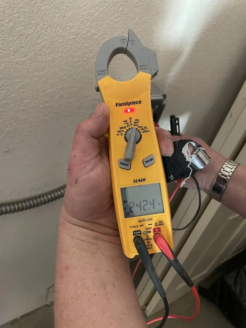 Voltage testing with clamp meter during Aluminum Wiring Replacement in Athens